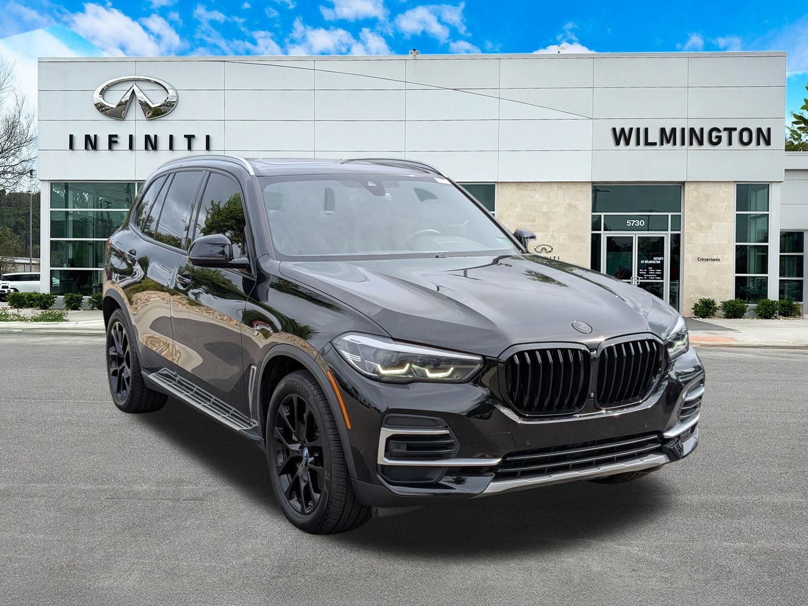 2023 BMW X5 xDrive45e in Jet Black — front three-quarter view