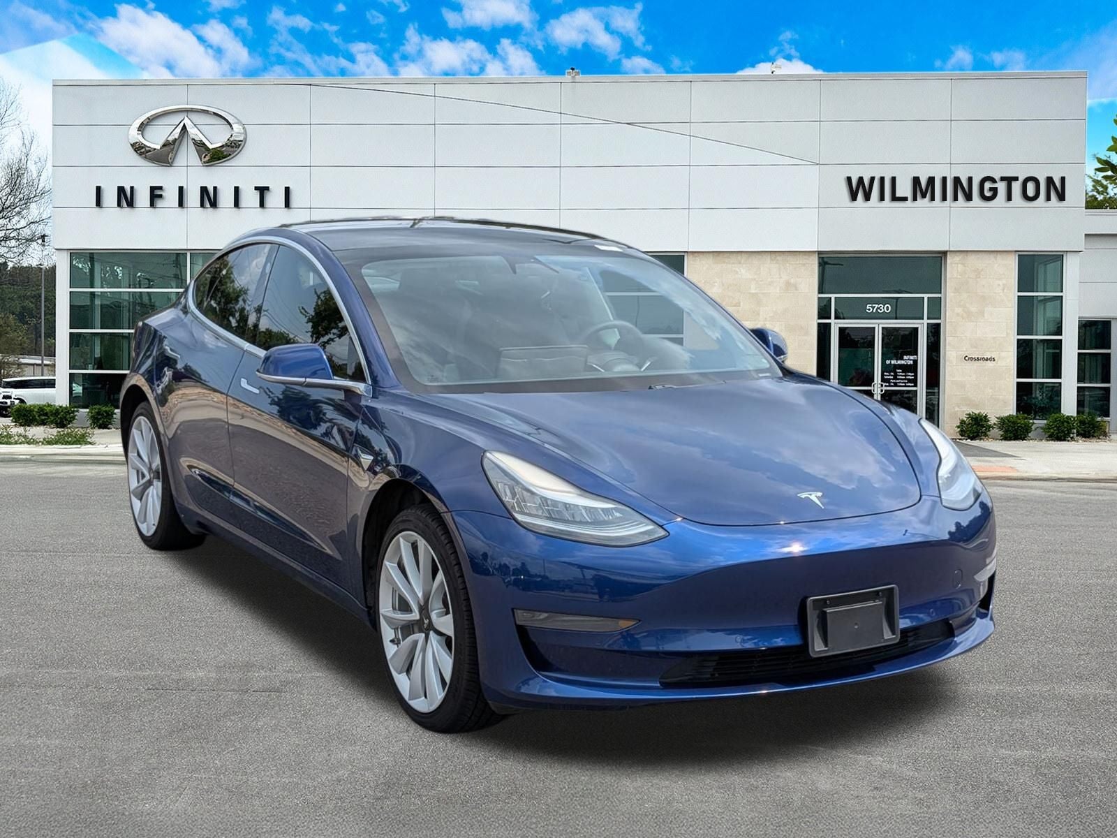 2020 Tesla Model 3 Standard in Deep Blue Metallic — front three-quarter view