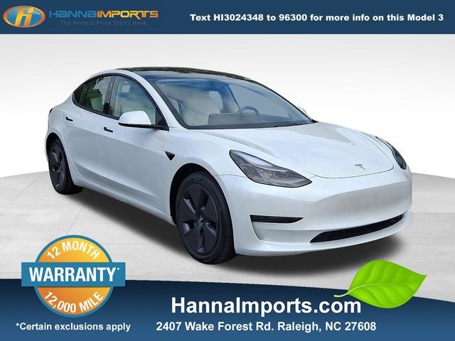 2023 Tesla Model 3 Base in White — front three-quarter view