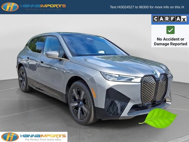 2023 BMW iX xDrive50 in Oxide Gray Metallic — front three-quarter view