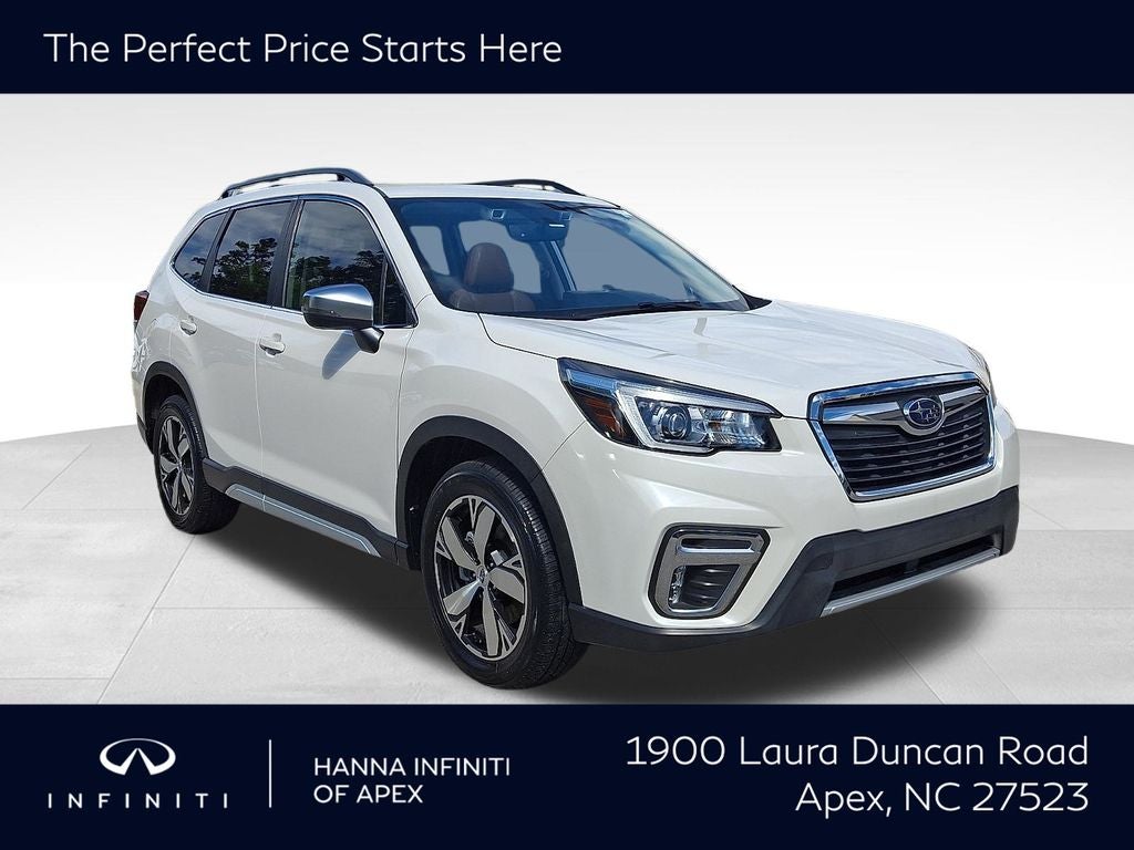 2020 Subaru Forester Touring in Crystal White Pearl — front three-quarter view